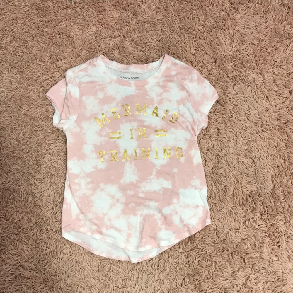 It is a pink and white shirt